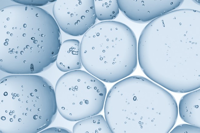 Close-up of translucent blue bubbles with reflections